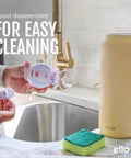 Person holding components of Pop And Fill 22oz Stainless Steel Water Bottle With Quick Fill Lid near sink