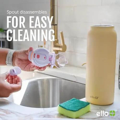 Person holding components of Pop And Fill 22oz Stainless Steel Water Bottle With Quick Fill Lid near sink