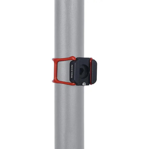 Beast Mode Hot Shoe Mount Adapter with Elastic Rubber Band wraps around a light pole, showcasing the sturdy attachment point.
