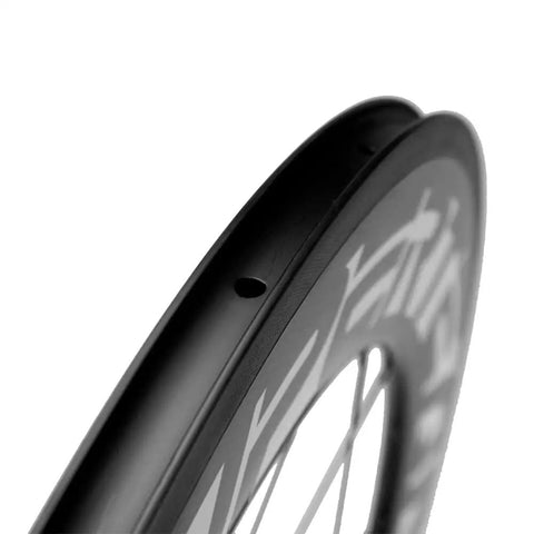Close-up of Beefy 88mm Carbon Wheelset For 700C Road Bikes Clincher With 291 Super Light Hub Basalt Brake Surface showing rim detail.