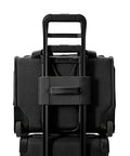 Back view of black Briggs & Riley carry-on luggage on wheels with extended telescoping handle