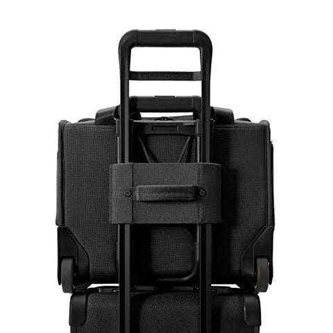 Back view of black Briggs & Riley carry-on luggage on wheels with extended telescoping handle