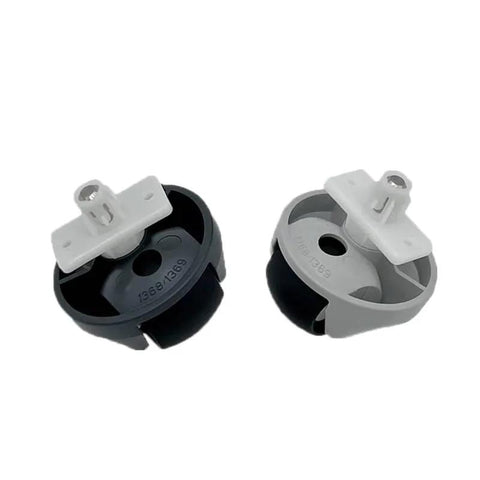 Two front wheel vacuum cleaner parts with white mounting brackets; black and gray wheel housings