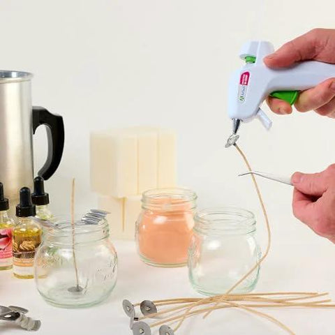 AdTech hot glue sticks, 4-inch mini size, clear; 30 sticks shown with glue gun for crafts.