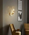 Modern Copper Crystal Wall Sconce Straight Up Stunning For Living Room And Bedroom Top Tier Bedside Lamps With Glare Free Hand Cut Shades giving soft light on wall.