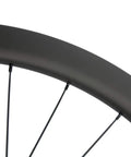 Close-up of Carbon Fiber Disc Brake Wheelset 700C Clincher Tubeless Ready 45mm Deep 25mm Wide UD Matte Finish rim and spokes.