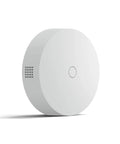 No Sweat Smoke And Carbon Monoxide Alarm Listener With Seamless Smart Home Hookup, round white compact design, side view.