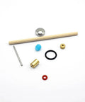Waterjet cutter on/off valve repair kit components: brass fitting, blue plastic knob, black O-ring, steel pin, brass bushing, red washer, wooden dowel