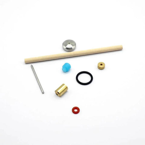 Waterjet cutter on/off valve repair kit components: brass fitting, blue plastic knob, black O-ring, steel pin, brass bushing, red washer, wooden dowel