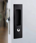 Matte black 6.3 inch recessed pocket sliding door handle with key installed on a white door; zinc alloy construction