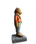 Side view of adorable hand painted teddy bear figurine with granite base modern resin statue for shelf desk or office.