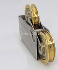 Heavy Duty Double Brass Window Slider Roller Set With Stainless Steel Axle And Copper Bearing Pulley Slick Glide Replacement For Vinyl Patio Doors Hassle Free Quick Swap Fix Stub Tracks Heavy Duty Upgrade, side view showing dual brass wheels.