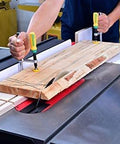 Person using Matchfit Dovetail Clamps Set With Soft Grip Handles Two Piece Two Pack For Precise Routing Fences And Sleds on a workbench.