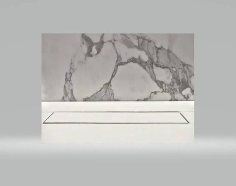 Heavy Duty Linear Shower Drain For Tile Floors Featuring A Slick Brushed Finish and integrated into a marble tile backdrop.
