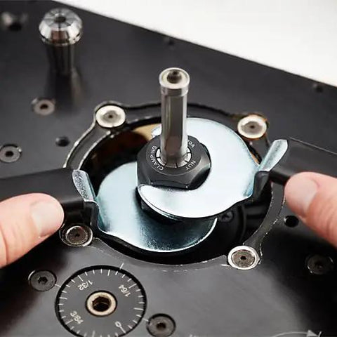Hands adjusting the bit on a Heavy Duty 3.25 HP Soft Start Router Motor for precise woodworking.