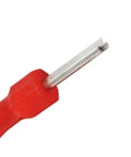 Close-up of red handled tool from R410A and R32 valve core kit for air conditioners metal lightweight spare part set with wrench and accessories.