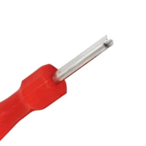 Close-up of red handled tool from R410A and R32 valve core kit for air conditioners metal lightweight spare part set with wrench and accessories.
