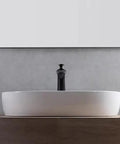 USZWBY Vessel Sinks Minimalist Ceramic Table Basin Home Hotel Bathroom Washbasin on wooden surface with dark faucet.
