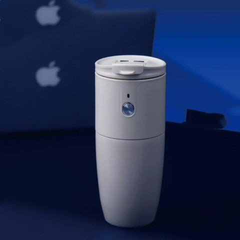 Compact Portable Coffee Maker With Built In Automatic Bean Grinder For Home Desk Or Road Trip brews smooth espresso quickly in a sleek grey design.