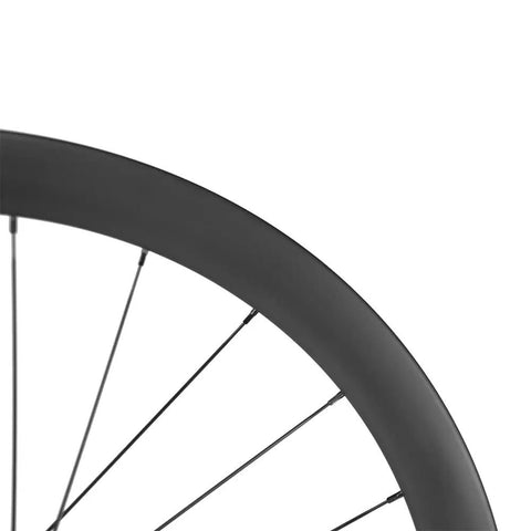 Close-up of Carbon Gravel Wheelset 700C Tubeless Disc Braking 45mm Depth Center Lock Thru Axle showcasing rim detail.