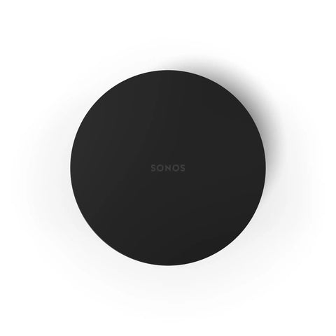 Top view of Sub Mini Compact Wireless Subwoofer For Beam And Ray, sleek black finish, circular design, flat surface.
