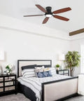 Bayfeve 52-Inch Flush-Mount Ceiling Fan with Light (Black + Plywood) in a modern bedroom setting with a bed and decorative lamps.
