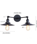 Badass Industrial Vintage Dual Light Wall Sconce Featuring Adjustable Metal Arms For Instant Room Upgrades Rock Solid Construction Easy Install In Stunning Chrome Or Sleek Matte Black Finishes Today. Image shows matte black dual light fixture with adjustable arms.