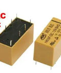 12V DC Coil DPDT 8 Pin PCB Power Relay Pack Of 10 HK19F, yellow, shown close-up and in hand for size reference.