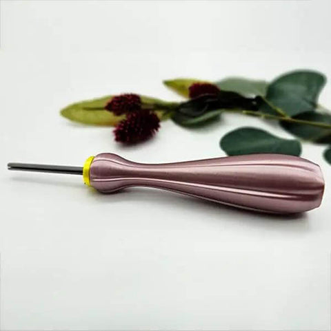 Quilling Bead Roller Tool Set With Slotted Winding Pins In Three Sizes Three Sixteenths Inch Five Thirty Seconds Inch And Five Sixty Fourths Inch For Diy Paper Jewelry Making Pink Pearl Silk Handle Color Coded Pin Bases And Bright Stainless Pins tool with yellow base on white surface.