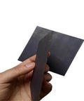 Hand holding 5 Pack Carbon Graphite Sheets 100x100x4mm Square Blocks For 3D Printing Crucibles And Tools High Temperature Durable Graphite Plates
