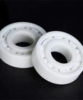 Close-up of zirconia fishing reel bearing 623CE, 3x10x4mm, made of full ceramic ZrO2 with PTFE for high speed and smooth casting.