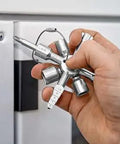 Hand holding TwinKey Multifunctional Spanner Kit with Magnetic Eight Arm Two By Four Way Spider Keys for control cabinets