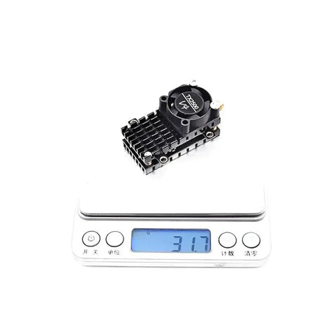 TX2500 V4 5 8 GHz FPV Transmitter With 2000mW Power Cooling Fan on digital scale weighing 31.7 grams