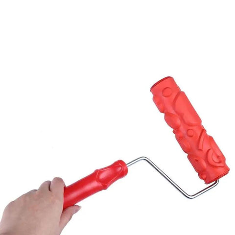 Killer DIY Doodle Dinosaur Wall Printing Roller with High Density Microfiber Cover and Sturdy Alloy Handle for Rad Home Decor Projects and Sick Wall Embossing Art held in hand.