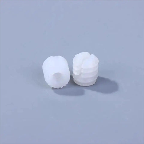 Close-up of white plastic dowel inserts from 1000 Pcs Heavy Duty White Plastic Dowel Nut Kit With Screw Dowel Inserts For Bathroom And Kitchen