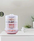 Slick Digital Food Dehydrator Featuring Five Stackable Trays Adjustable Heat Control Plus Solid Forty Eight Hour Timer with dried fruits.