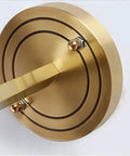 Modern Copper Crystal Wall Sconce Straight Up Stunning For Living Room And Bedroom Top Tier Bedside Lamps With Glare Free Hand Cut Shades, close up view of round brass mounting plate.