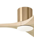 Slick Fifty Two Inch Hugger Ceiling Fan In Burnished Brass With Three Washed White Oak Blades mounted on a low ceiling.