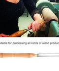 Woodturning chisel with wooden handle and steel blade; side view of tool in use on a wood lathe