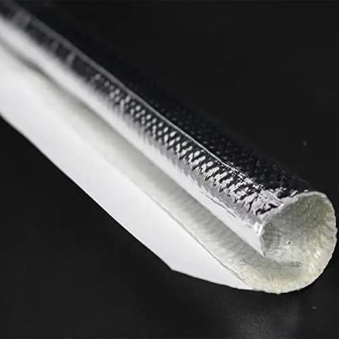 Close-up of Heavy-Duty Self-Wrap Aluminum Heat Shield Sleeve for hoses, wiring harnesses, and cables in automotive exhaust.