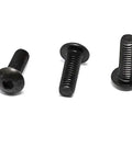 Close-up of three M4 X 12mm hex socket button head cap screws in black oxide finish from the Shop Essentials 100 Piece kit.