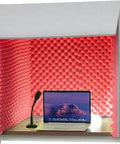 Portable Foldable Sound Booth For Home Studio Sessions And Podcasts with high density acoustic cotton, featuring a laptop and microphone.