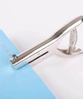 Tough As Nails Single Hole Punch for Crafts and Scrapbooks, quarter inch zinc alloy hole puncher used on blue paper.