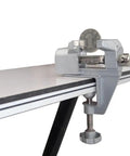 Rock Solid Compact Swivel Vise For Crafters And DIYers That Secures Quickly To Tables Or Benches And Edges holding a coin