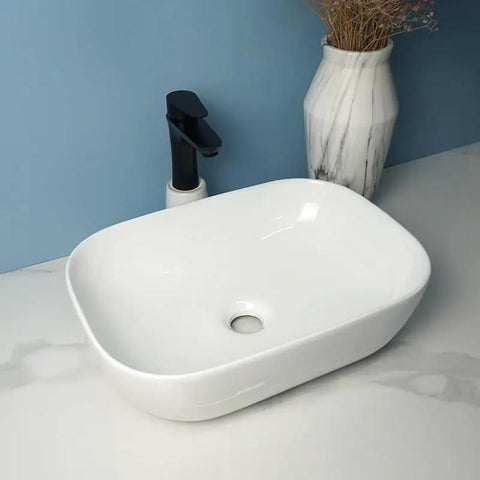 USZWBY Vessel Sinks Square Rounded Corner Simple Sink Ceramic Above Counter Wash Basin with smooth curved edges.