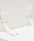 Heavy Duty No Drill Furniture Anchors For Baby Proofing with upgraded adhesive straps installed on a white surface.