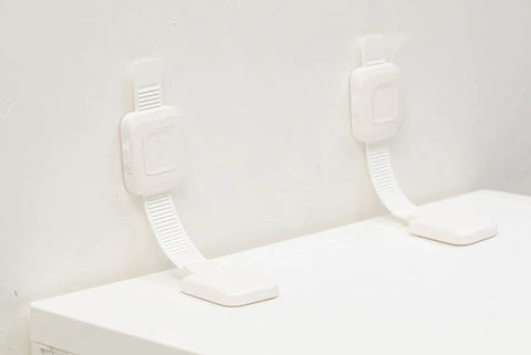 Heavy Duty No Drill Furniture Anchors For Baby Proofing with upgraded adhesive straps installed on a white surface.
