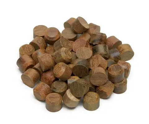 Ultimate Pro Plug System Deck Kit With 100 Ipe Plugs And 2 1 2 Inch Stainless Steel Screws Including Glue Nozzle And T20 Bit For A Badass Finish On Starter And Ender Boards Of Premium Hardwood Decks Today - 100 Ipe plugs arranged in a pile.