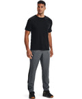 Model wearing Mens Woven Vital Workout Pants With Ripstop Fabric Regular Fit Joggers Windbreaker Style Lightweight Construction Pitch Gray Black XX Large