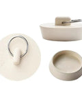 Close-up of a white rubber sink stopper with pull ring, universal fit for kitchen or bath, part of Six Size Rubber Sink Stoppers With Pull Ring Universal Fit Drain Plugs Fits Kitchen Bath Laundry Tub Leak Proof Anti Odor No Hassle Install Works Like A Champ For Every Home Owner Who Demands Top Notch Plumbing Fixes.